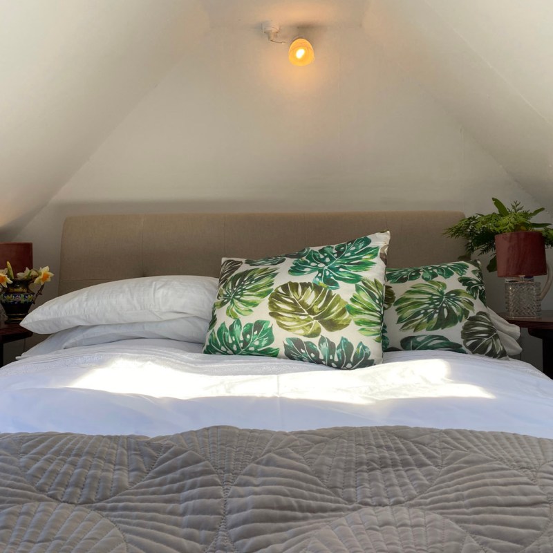 a made bed in a hotel room