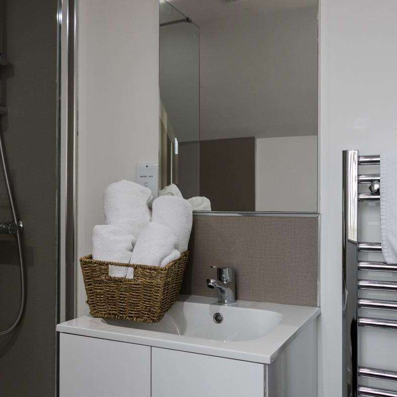 a room with a sink and a mirror