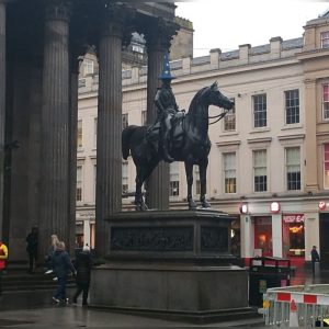 a statue in front of a building