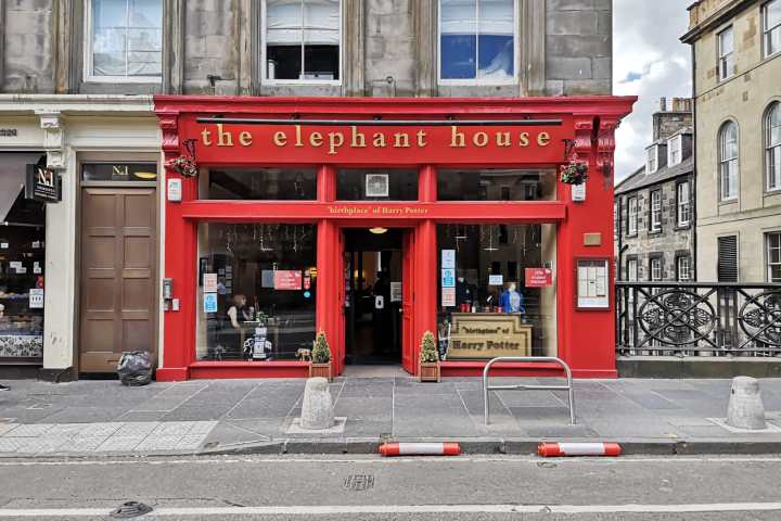 a double decker bus parked in front of a building