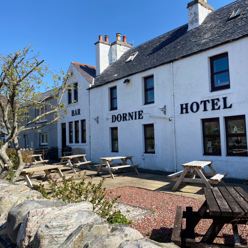 a stone house sitting on a rock